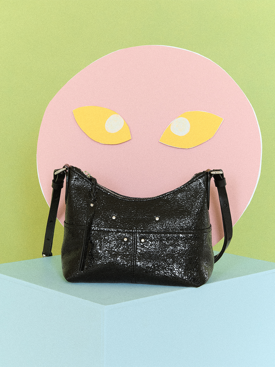 Lifestyle photo, small metallic black leather shoulder bag, PAUL MARIUS LeLoustic Eclipse